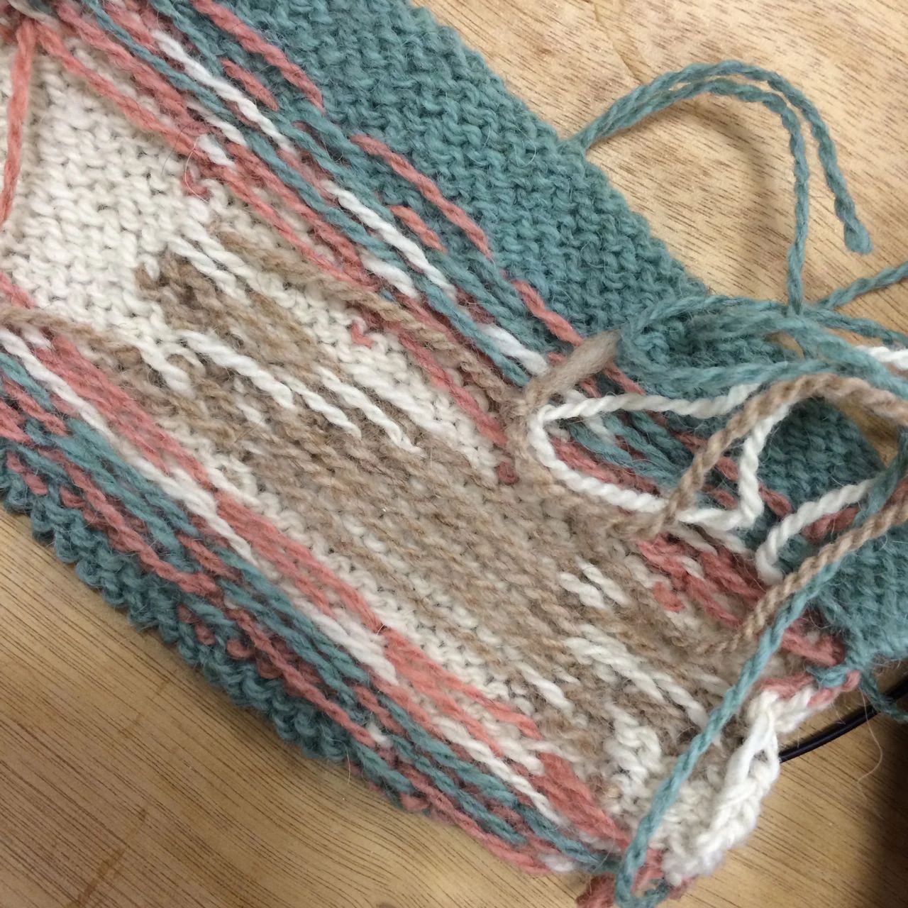 Here is my swatch with stranding between foxes, knitted using Fair Isle.